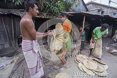 Hand fans are made at Dhakaâ€™s Bhatara while Mymensingh supplies the raw materials. Editorial Stock Photo
